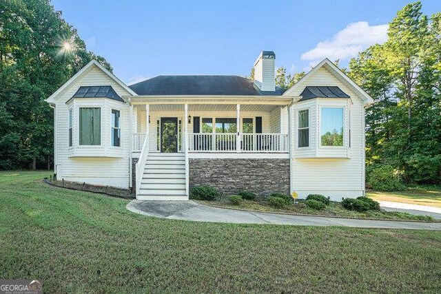 view of front of house with a front lawn and a porch