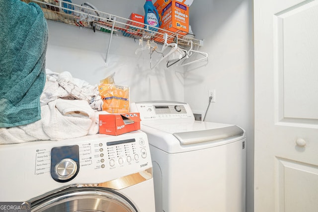 laundry area featuring washing machine and dryer