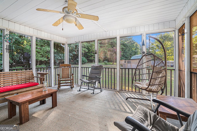 sunroom featuring ceiling fan