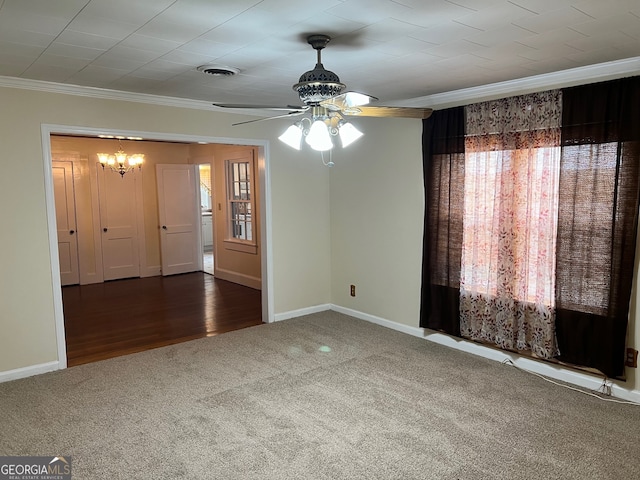 empty room featuring ceiling fan, dark hardwood / wood-style floors, and ornamental molding