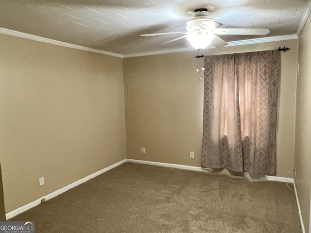 empty room with ornamental molding, ceiling fan, and carpet flooring