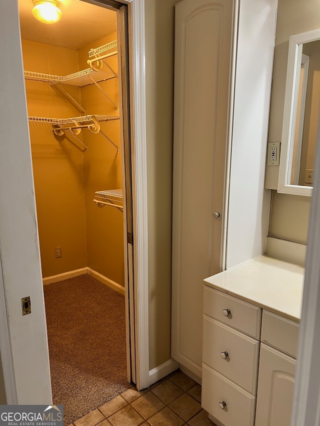 bathroom with vanity and tile patterned flooring