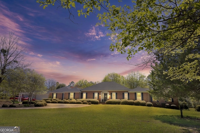 view of front of home with a yard