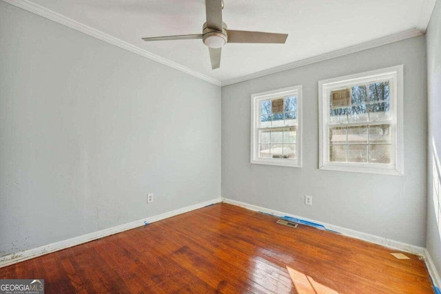 spare room with ceiling fan, hardwood / wood-style floors, and ornamental molding