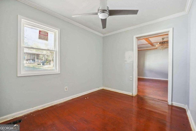 empty room featuring ceiling fan, ornamental molding, and wood-type flooring