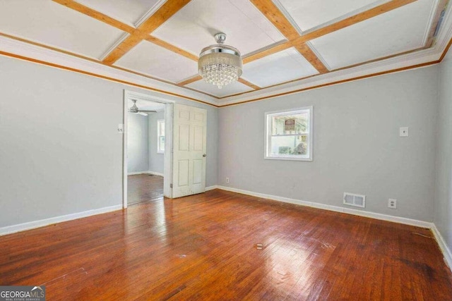 unfurnished bedroom featuring coffered ceiling and wood-type flooring