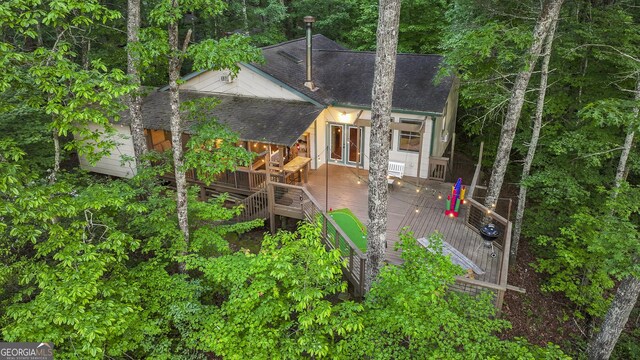 back of property featuring a deck