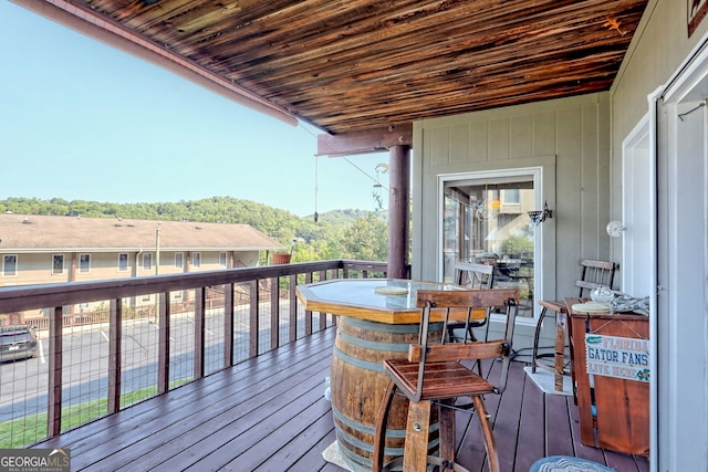 wooden deck with a mountain view