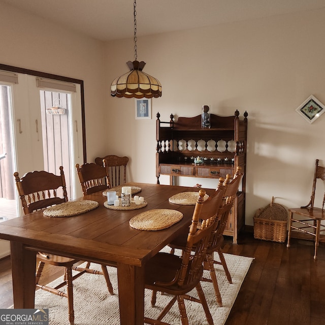 dining room with dark wood-type flooring