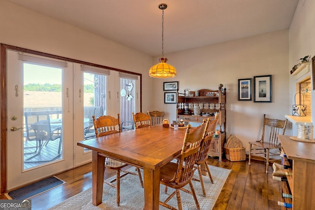 dining area with dark hardwood / wood-style floors