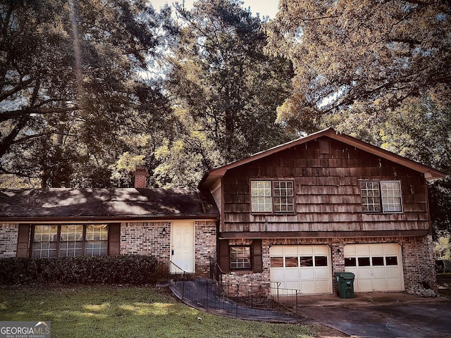 front facade with a front yard and a garage