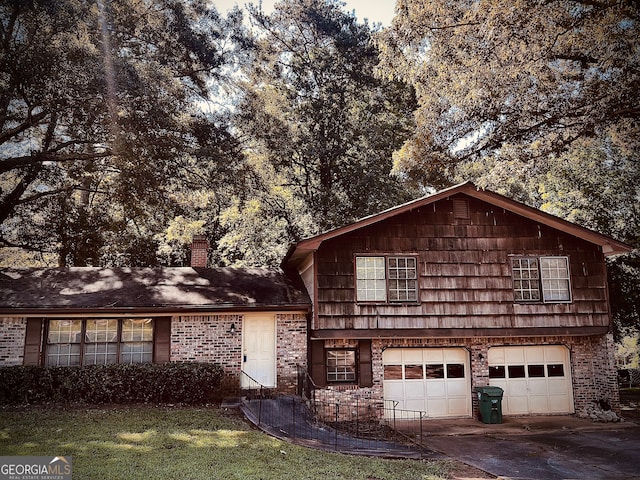 front of property with a front lawn and a garage