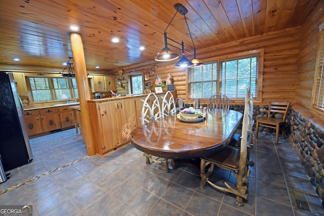 dining area featuring log walls and wood ceiling