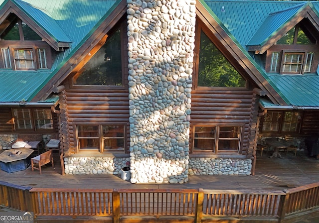 rear view of property with a wooden deck