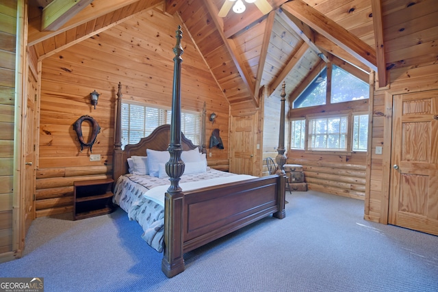 bedroom featuring beamed ceiling, wood ceiling, rustic walls, and high vaulted ceiling