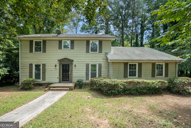 view of front of home with a front yard