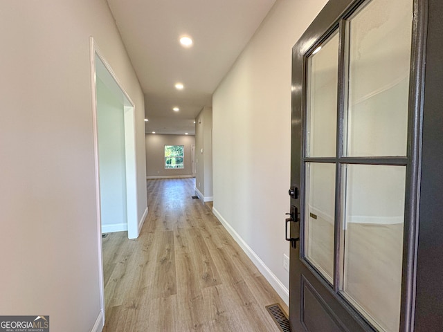 hall featuring light hardwood / wood-style flooring