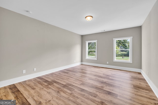 spare room featuring light hardwood / wood-style floors