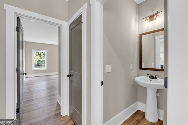 bathroom featuring sink and hardwood / wood-style floors