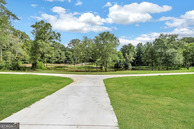 surrounding community featuring a lawn