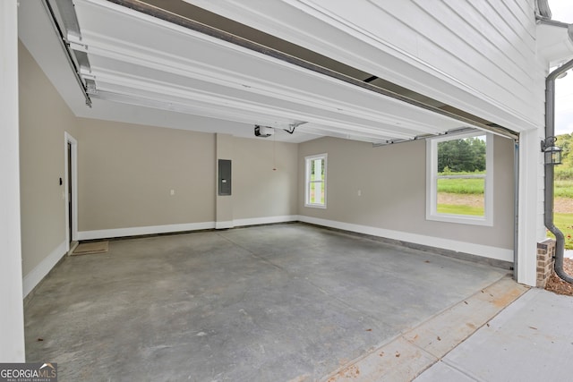 garage featuring a garage door opener and electric panel