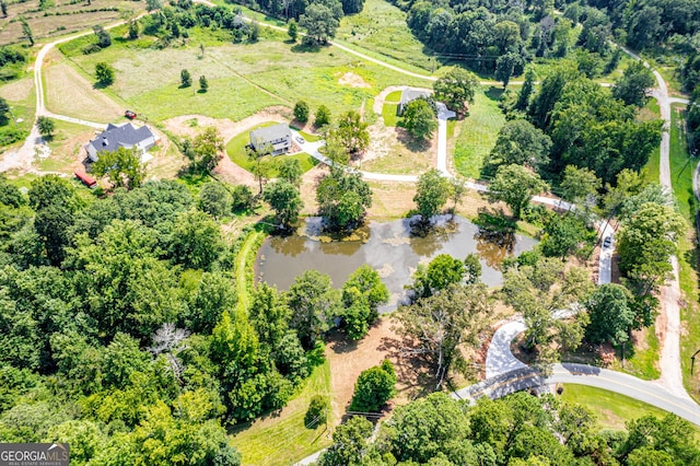 drone / aerial view with a water view and a rural view