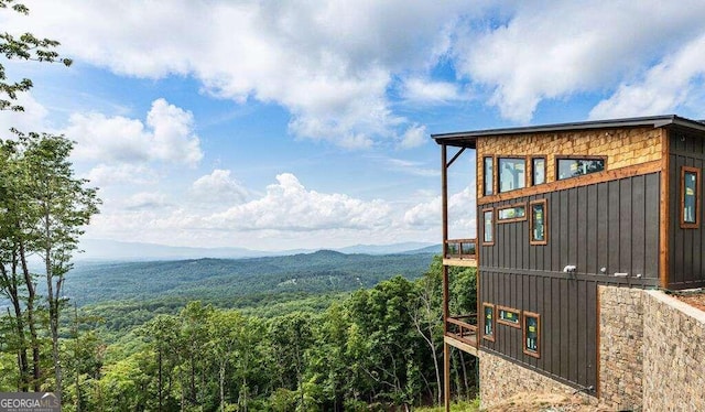 view of property exterior featuring a mountain view