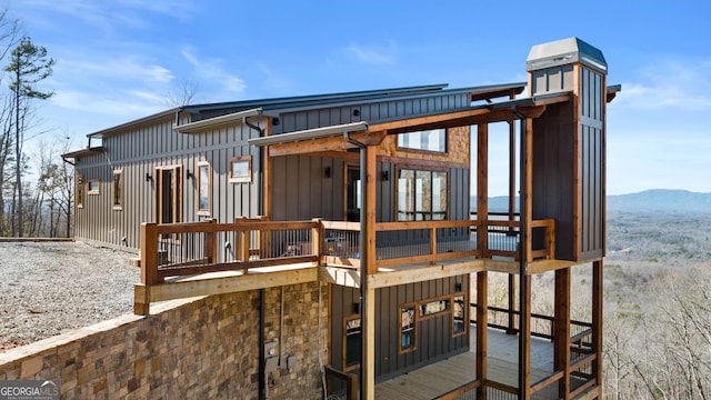 back of house with a mountain view