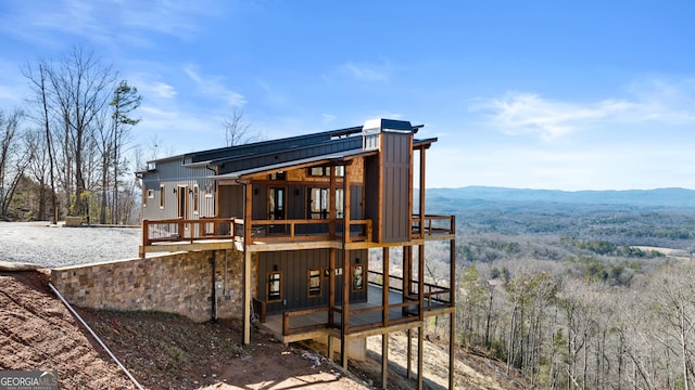 back of house with a mountain view