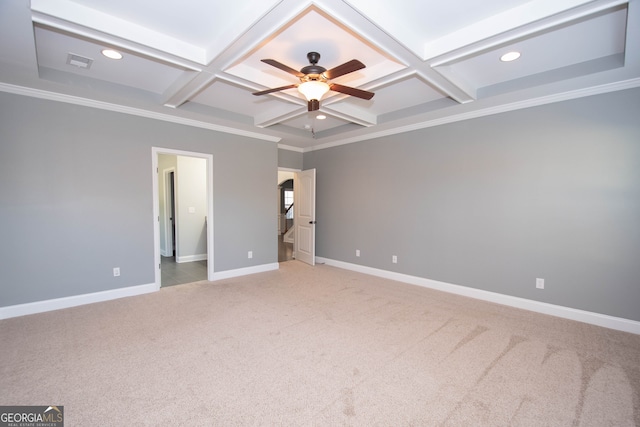 carpeted empty room with beam ceiling, ornamental molding, and coffered ceiling