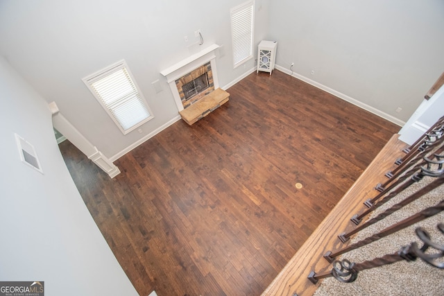 unfurnished living room featuring dark hardwood / wood-style flooring