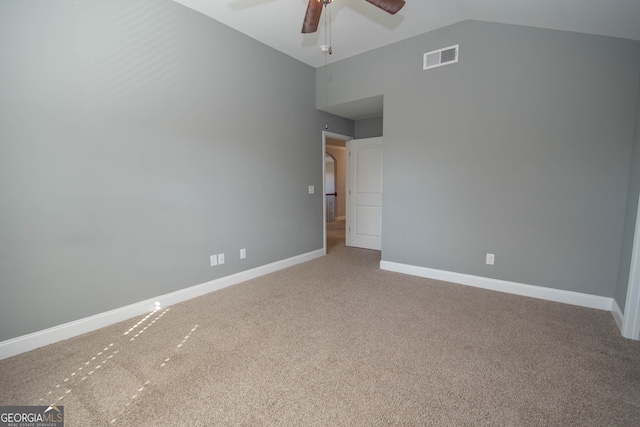 unfurnished bedroom featuring ceiling fan, carpet floors, and vaulted ceiling