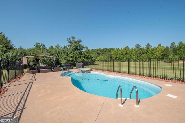 view of pool with an in ground hot tub and a patio area