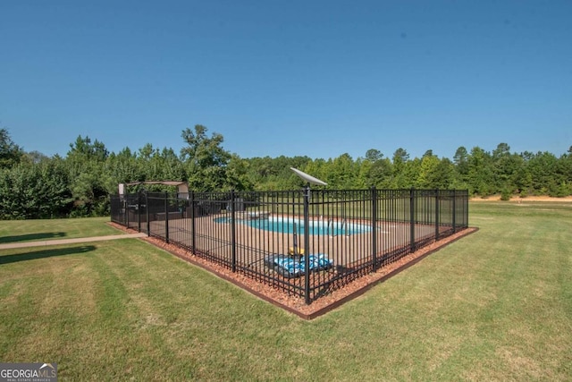 view of swimming pool featuring a lawn