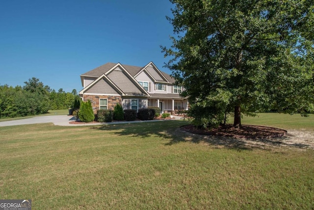 craftsman inspired home with a front yard