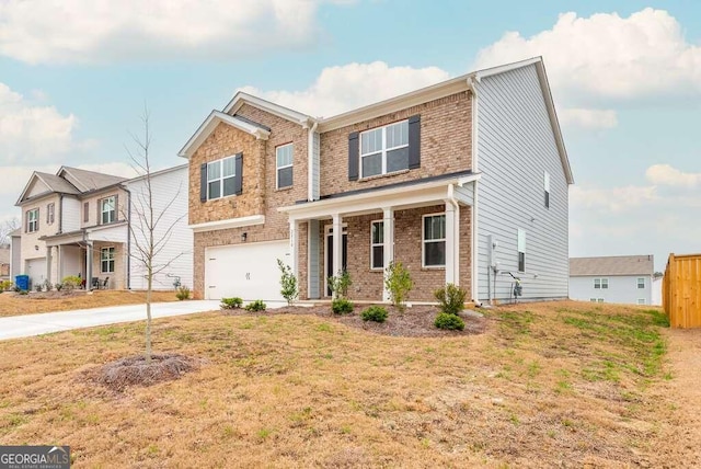 view of front of home with a garage and a front lawn