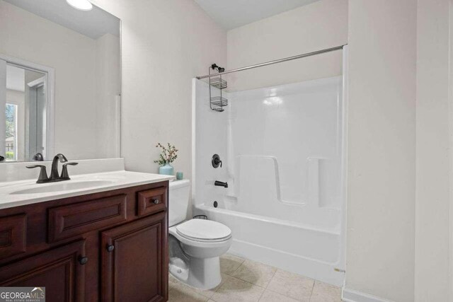 full bathroom featuring shower / bathtub combination, tile patterned floors, toilet, and vanity