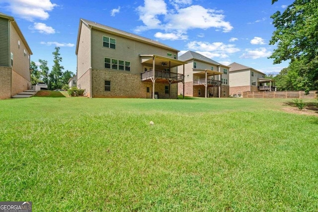 rear view of house with a lawn