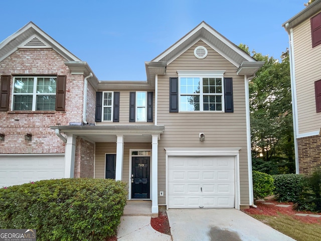 front of property with a garage