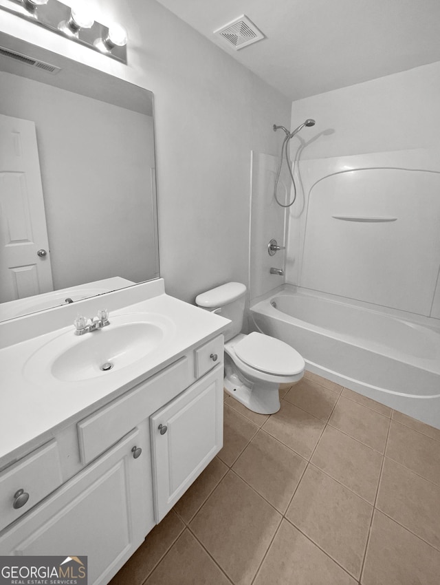 full bathroom featuring tile patterned floors, toilet, vanity, and shower / bathing tub combination