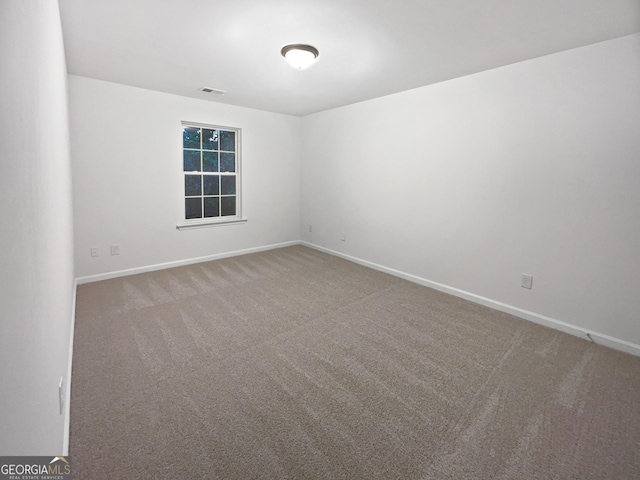 unfurnished room with carpet