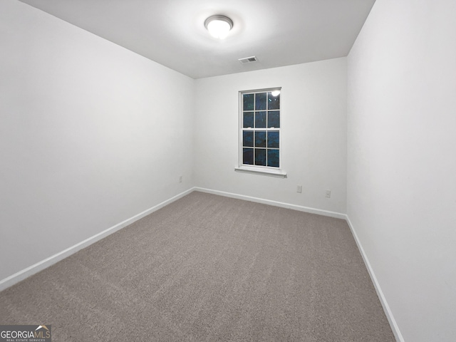 spare room featuring carpet floors