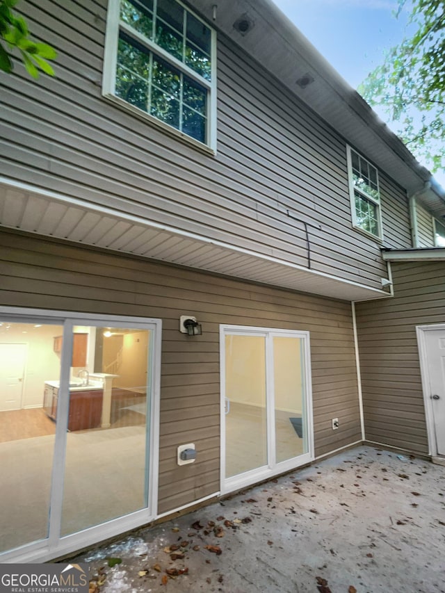 rear view of house featuring a patio