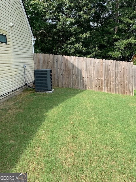 view of yard featuring central AC