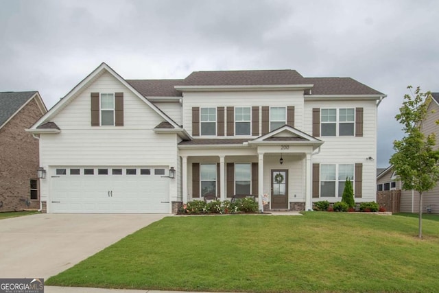 view of front of house featuring a front yard and a garage