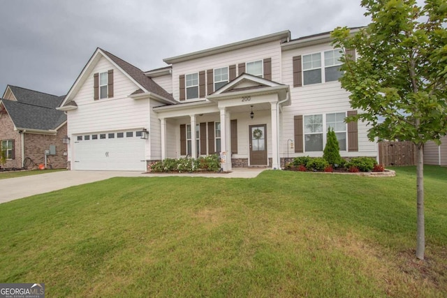 view of front of property featuring a garage, a porch, and a front yard