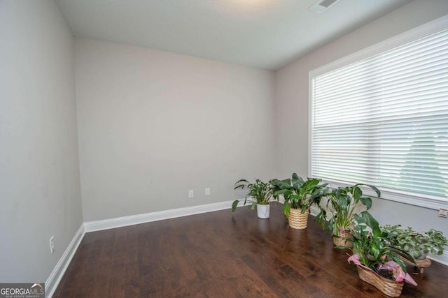 spare room featuring hardwood / wood-style floors