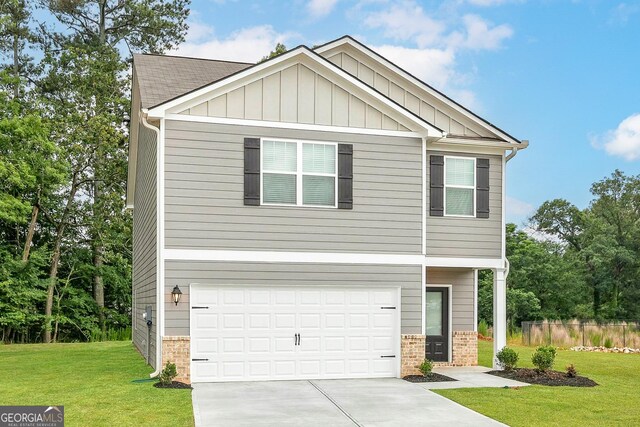 craftsman-style home featuring a front yard and a garage