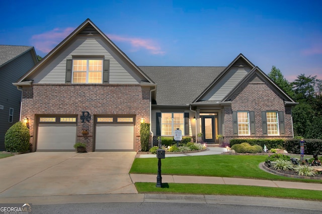 view of front of house featuring a garage, brick siding, driveway, roof with shingles, and a front lawn