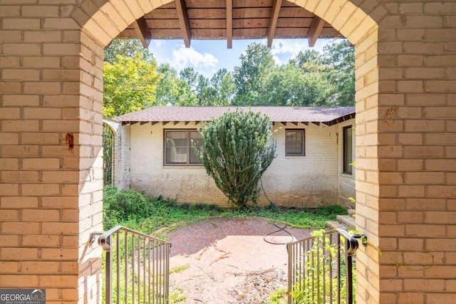 view of property exterior with a patio area